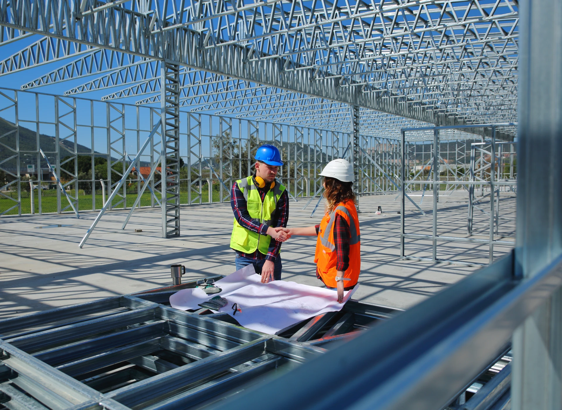 Engineers shaking hands on site